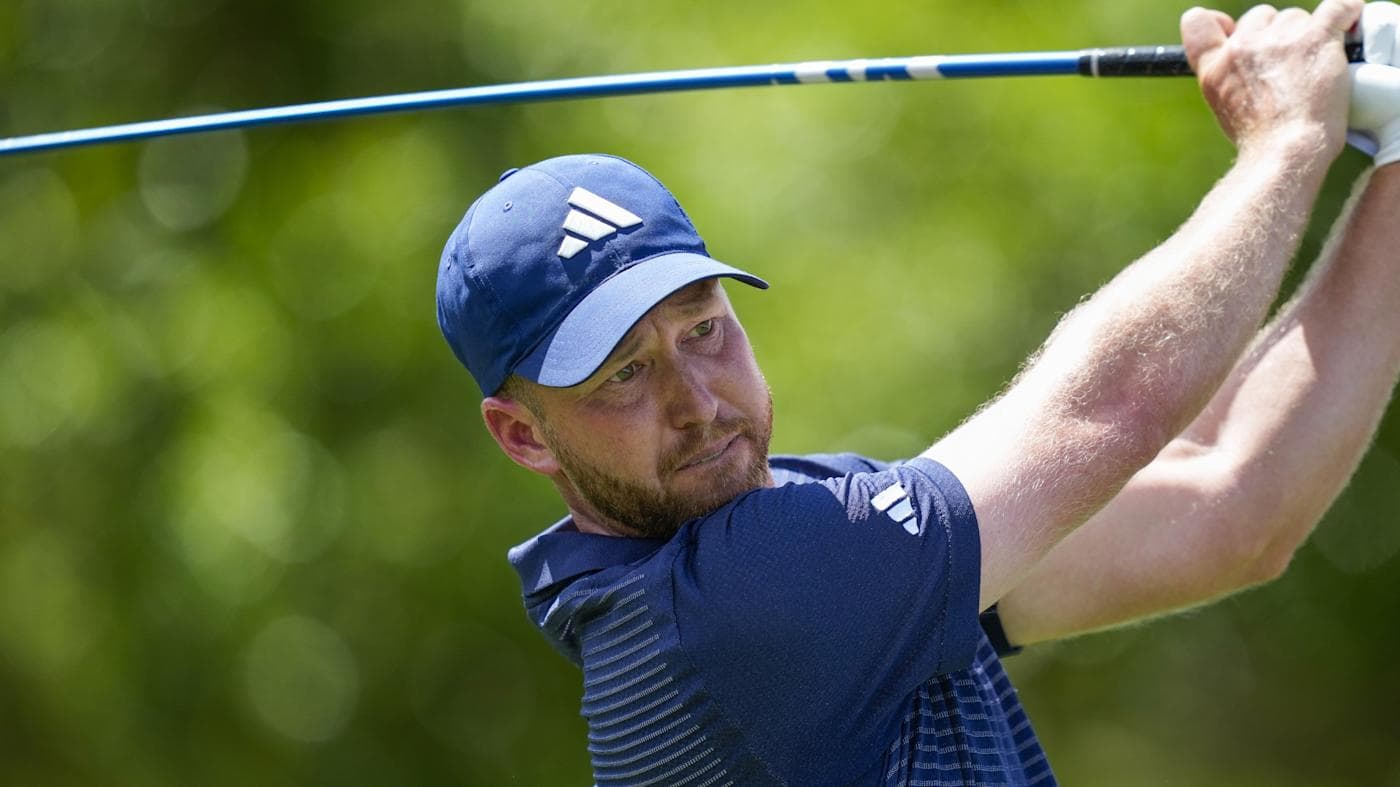 Daniel Berger in a white cap and black shirt, fist raised at the 2026 Arnold Palmer Invitational.