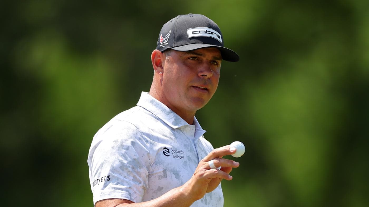 Gary Woodland in a white cap and black shirt, fist raised at the 2026 Houston Open.