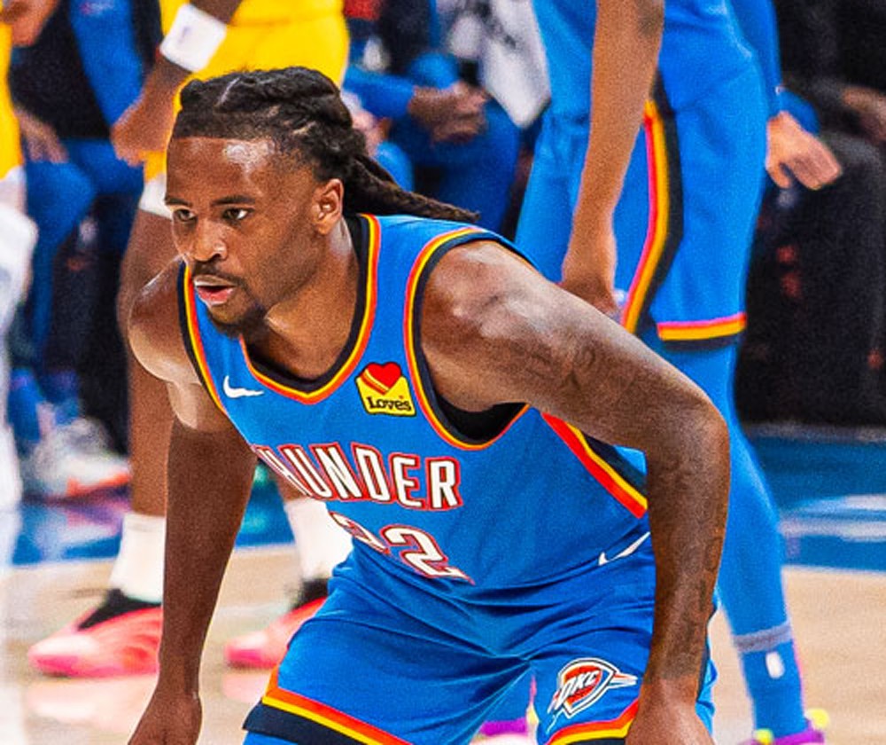 Shai Gilgeous-Alexander in a white Oklahoma City Thunder jersey, number 2, in the lane during Game 7 of the 2025 NBA Finals.