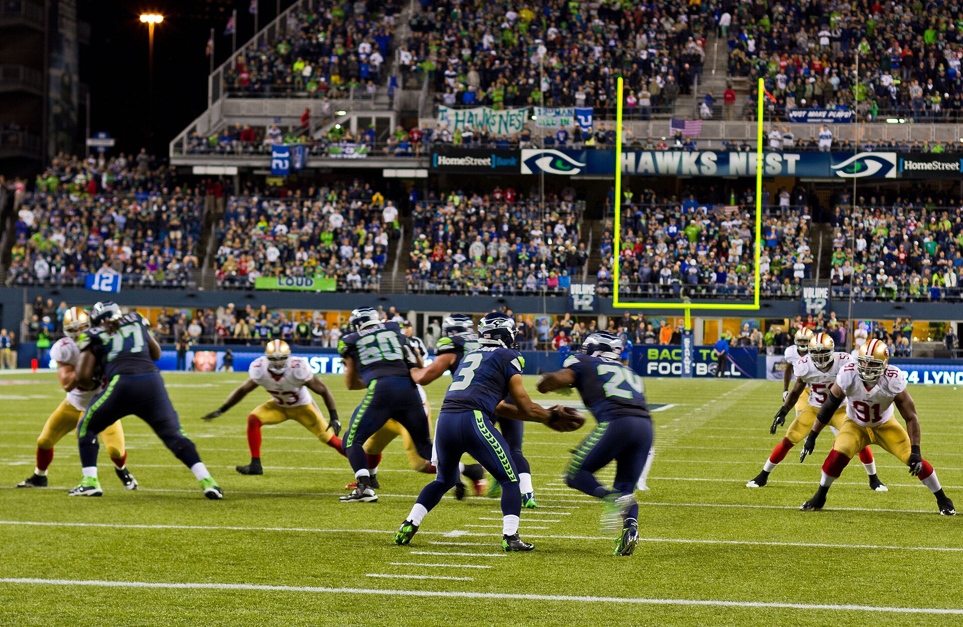 Archive photograph: Russell Wilson hands off the football to Marshawn Lynch.